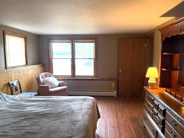 160 Pinkhams Cove Rd, Belgrade, ME 04917 - bedroom with a baseboard radiator and wood finished floors