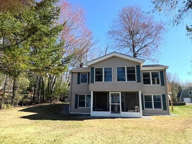 160 Pinkhams Cove Rd, Belgrade, ME 04917 - rear view of house featuring a sunroom and a yard