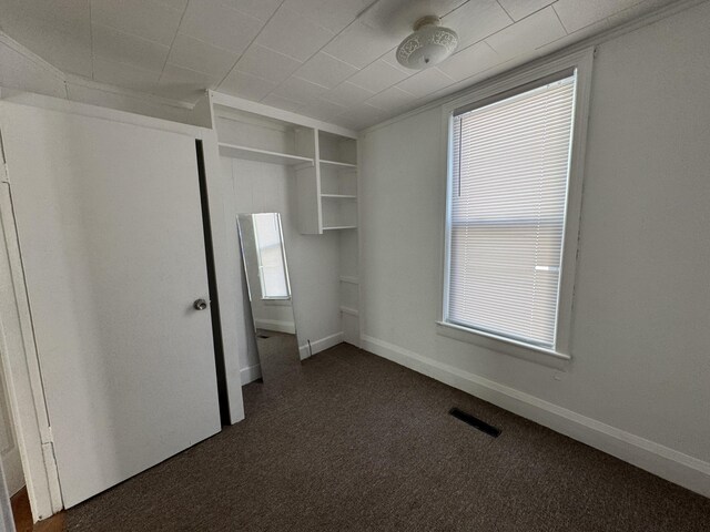 159 Elm St, Bangor, ME 04401 - unfurnished bedroom with dark carpet