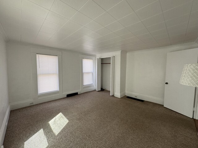 159 Elm St, Bangor, ME 04401 - unfurnished bedroom featuring crown molding, carpet floors, and baseboards
