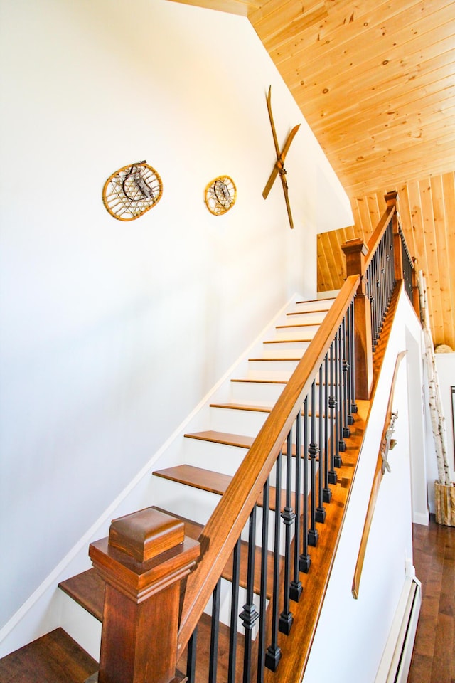28 First St, Bethel, ME 04217 - staircase with wood finished floors, wood ceiling, a baseboard heating unit, and high vaulted ceiling