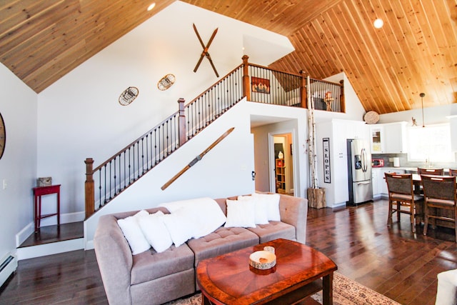 28 First St, Bethel, ME 04217 - living room with high vaulted ceiling, wood ceiling, stairs, dark wood-style floors, and a baseboard heating unit