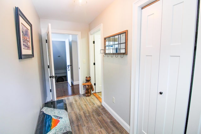 28 First St, Bethel, ME 04217 - hall with wood finished floors and baseboards