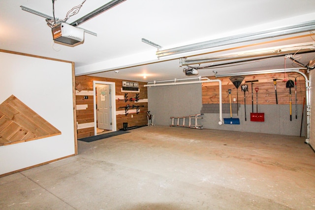 28 First St, Bethel, ME 04217 - garage with a garage door opener and wood walls