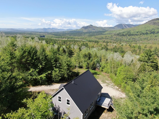 28 First St, Bethel, ME 04217 - view from above of property featuring a heavily wooded area and mountains