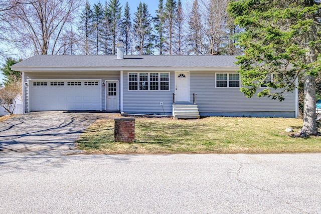 ranch-style home featuring a garage, a front lawn, aphalt driveway, a chimney, and entry steps