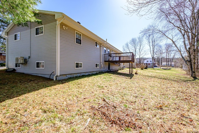 view of home's exterior with a yard and a deck