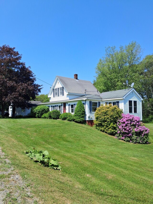67 Huddle Rd, Bristol, ME 04554 - view of front of house with a chimney and a front lawn