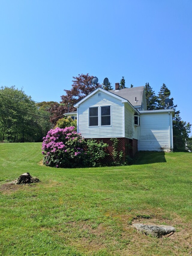 67 Huddle Rd, Bristol, ME 04554 - view of home's exterior with a yard