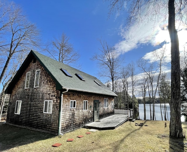 25 Lois Ln, Penobscot, ME 04476 - back of property featuring roof with shingles and a deck