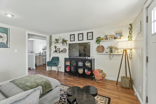 834 Main St, Bradley, ME 04411 - living room featuring baseboards and wood finished floors