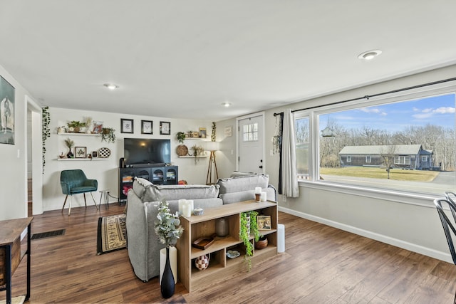 834 Main St, Bradley, ME 04411 - living area featuring baseboards and wood finished floors