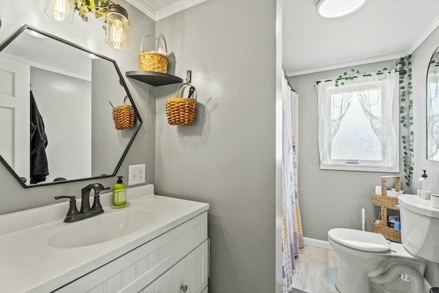 834 Main St, Bradley, ME 04411 - full bathroom featuring baseboards, ornamental molding, toilet, wood finished floors, and vanity