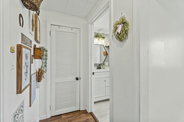 834 Main St, Bradley, ME 04411 - hallway featuring crown molding and dark wood-type flooring