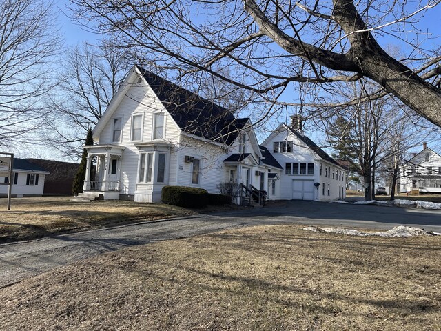 view of property exterior featuring aphalt driveway