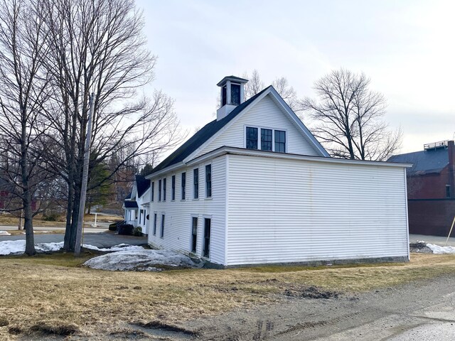 view of side of property featuring a chimney
