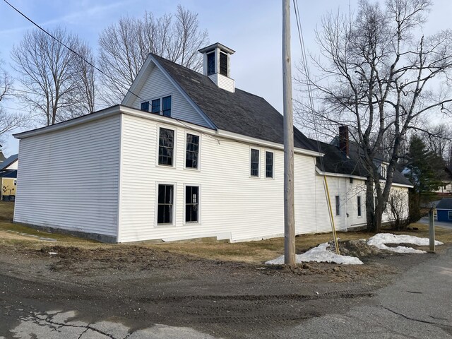 view of home's exterior featuring a chimney