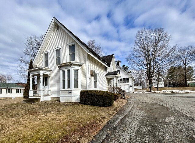 view of side of home featuring driveway