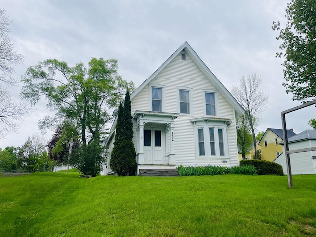 132 E Main St, Dover-Foxcroft, ME 04426 - view of front facade featuring a front lawn