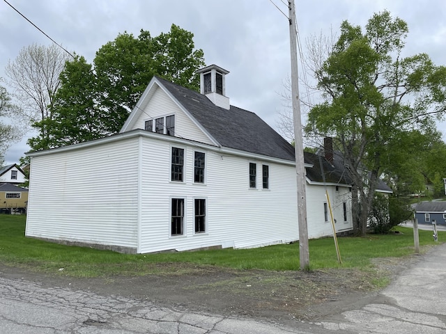 132 E Main St, Dover-Foxcroft, ME 04426 - view of home's exterior with a chimney and a shingled roof