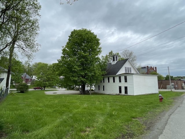 132 E Main St, Dover-Foxcroft, ME 04426 - view of side of home with a yard