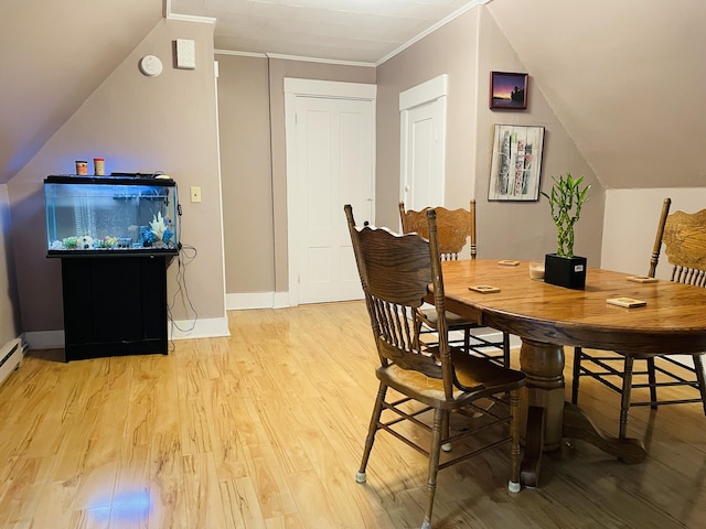 132 E Main St, Dover-Foxcroft, ME 04426 - dining space featuring light wood-type flooring, baseboards, crown molding, and lofted ceiling