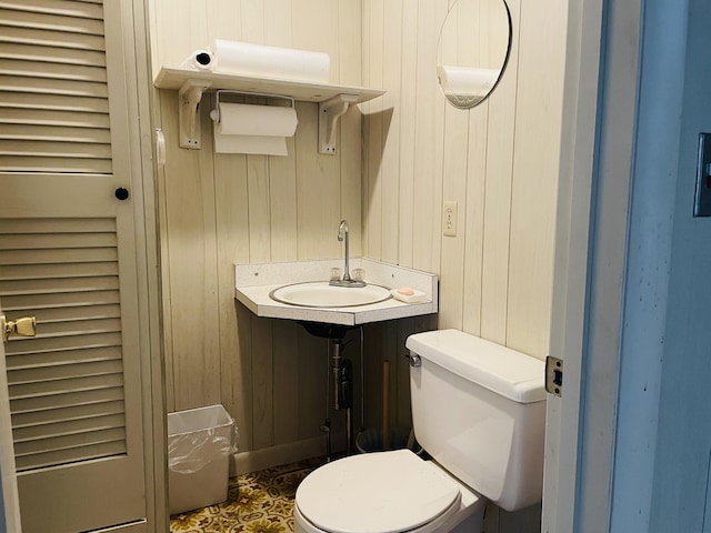 132 E Main St, Dover-Foxcroft, ME 04426 - half bath featuring toilet, vanity, and wooden walls
