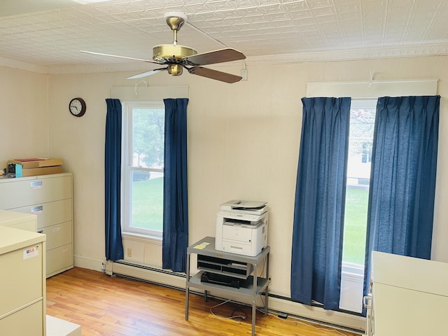 132 E Main St, Dover-Foxcroft, ME 04426 - bedroom with ornamental molding, light wood finished floors, a baseboard heating unit, and ceiling fan