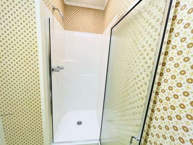 132 E Main St, Dover-Foxcroft, ME 04426 - bathroom featuring wallpapered walls, a shower stall, and crown molding