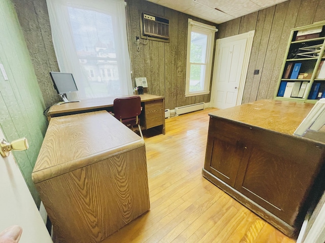 132 E Main St, Dover-Foxcroft, ME 04426 - office area featuring wood walls, light wood-style floors, baseboard heating, and an AC wall unit