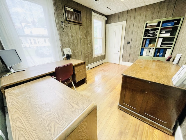 132 E Main St, Dover-Foxcroft, ME 04426 - office area with a baseboard radiator, wood finished floors, a wall unit AC, and wood walls
