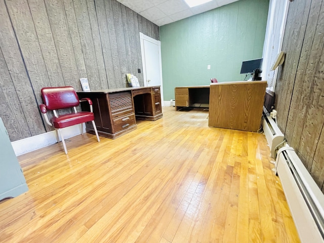 132 E Main St, Dover-Foxcroft, ME 04426 - home office featuring baseboard heating, wood-type flooring, a drop ceiling, and baseboards