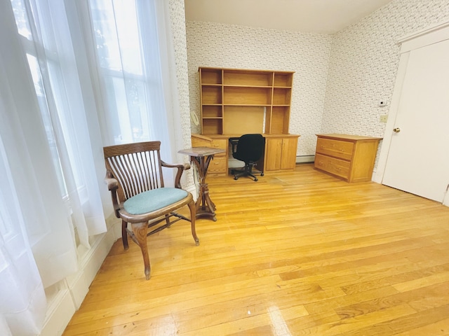 132 E Main St, Dover-Foxcroft, ME 04426 - office area with wallpapered walls, light wood-style floors, plenty of natural light, and a baseboard radiator