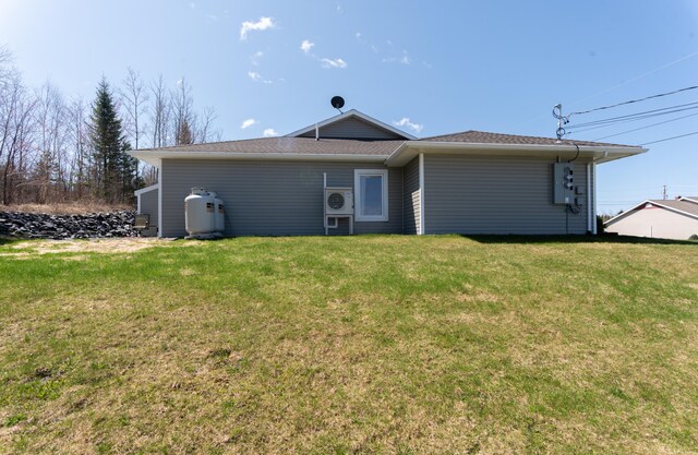 308 19th Ave Unit 101, Madawaska, ME 04756 - rear view of house featuring a lawn