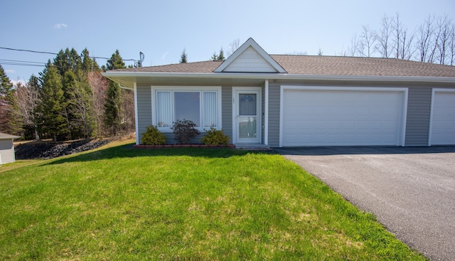 308 19th Ave Unit 101, Madawaska, ME 04756 - view of front facade with driveway, a garage, and a front lawn