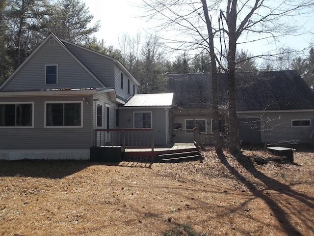 8 Varney Loop, Crawford, ME 04694 - rear view of house featuring a deck and metal roof
