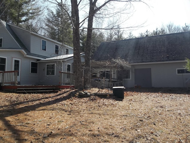 8 Varney Loop, Crawford, ME 04694 - back of house featuring roof with shingles and a wooden deck