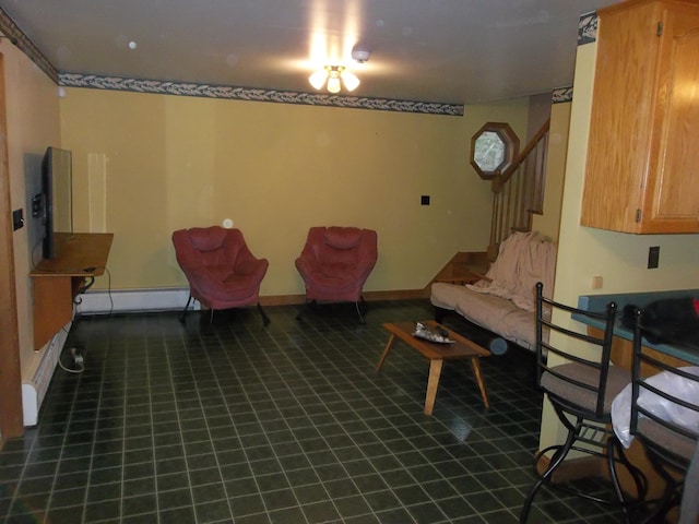 8 Varney Loop, Crawford, ME 04694 - living area with stairway, baseboards, baseboard heating, and tile patterned floors