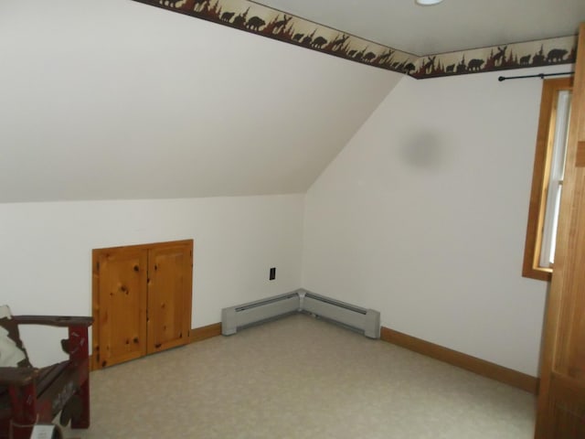 8 Varney Loop, Crawford, ME 04694 - additional living space featuring light colored carpet, baseboards, lofted ceiling, and a baseboard heating unit