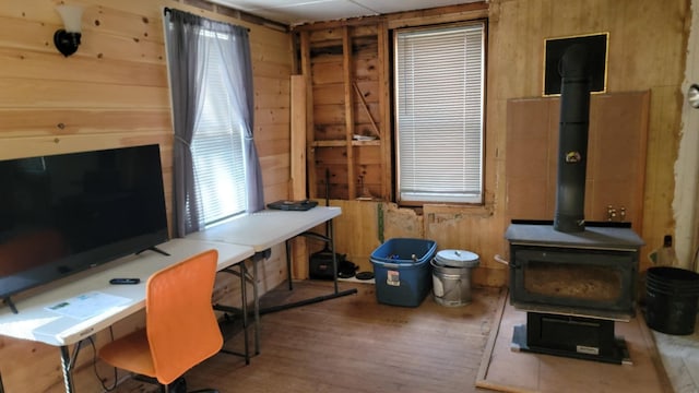 5 Johnson St, Eastport, ME 04631 - office with wood finished floors, a wood stove, and wooden walls