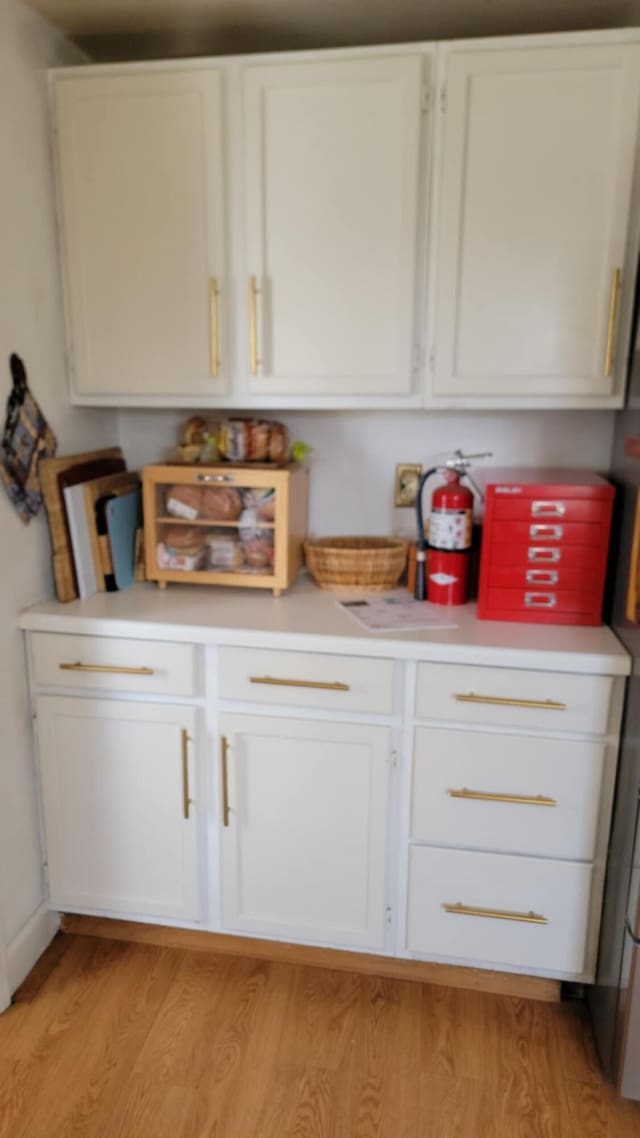 5 Johnson St, Eastport, ME 04631 - kitchen with white cabinetry, light countertops, and light wood-type flooring