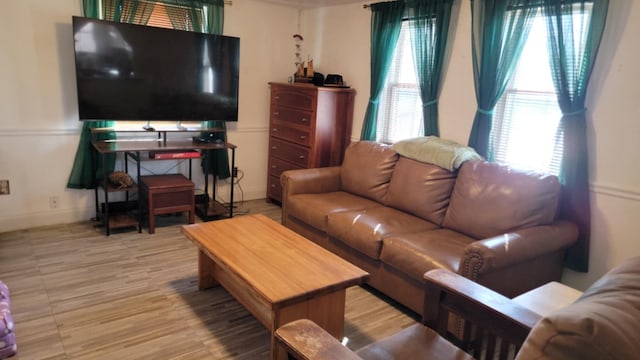 5 Johnson St, Eastport, ME 04631 - living room with plenty of natural light, baseboards, and wood finished floors