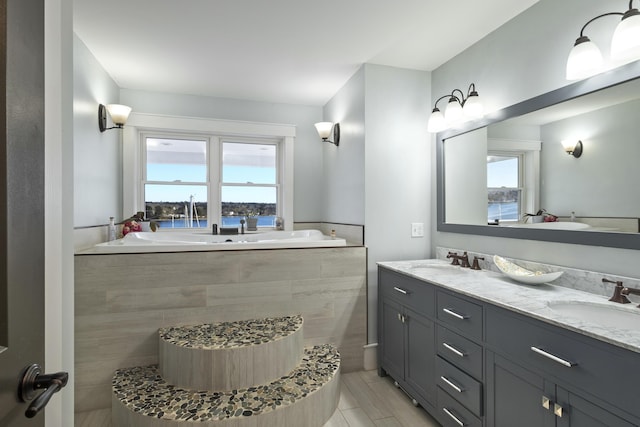 51 Bridge St, Belfast, ME 04915 - full bath featuring a sink, a bath, and double vanity