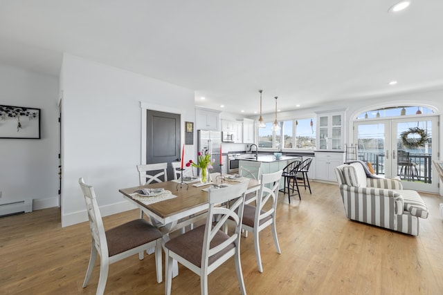 51 Bridge St, Belfast, ME 04915 - dining area with recessed lighting, light wood finished floors, french doors, and baseboards