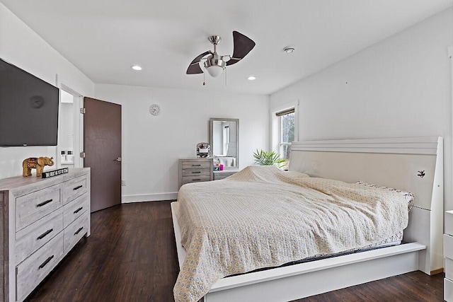 bedroom with dark wood finished floors, baseboards, and recessed lighting