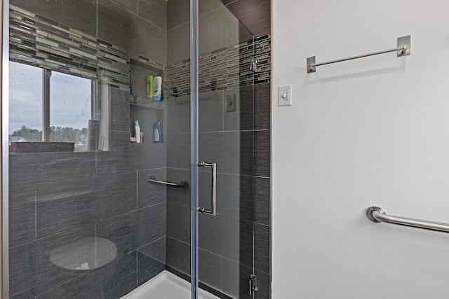 bathroom featuring a shower stall