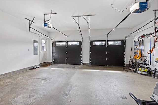 garage featuring electric panel and a garage door opener