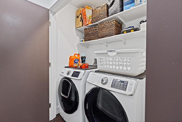 laundry room with separate washer and dryer and laundry area