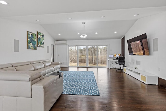 living room with recessed lighting, vaulted ceiling, wood finished floors, and a wall unit AC