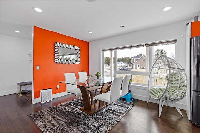 dining area with baseboards, dark wood-style floors, and recessed lighting